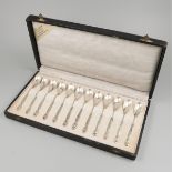 12-piece set of silver teaspoons.