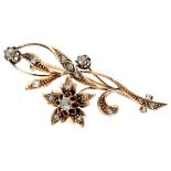 Antique 14K. rose gold brooch depicting a flower set with rose cut diamonds.