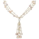 Three-row freshwater pearl necklace with a 14K. yellow gold closure.