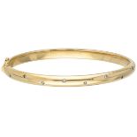 14K. Yellow gold bangle bracelet set with approx. 0.08 ct. diamond.