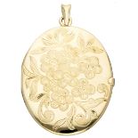 Vintage 14K. yellow gold medallion pendant with engraved floral details.