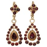 Antique 14K. yellow gold earrings set with rose cut garnets.