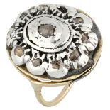 Antique 10K. yellow gold ring set with rose cut diamonds in a silver centerpiece.