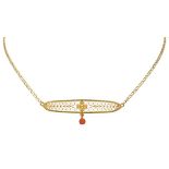 14K. Yellow gold necklace with antique filigree pendant set with red coral.