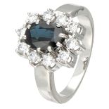 14K. White gold entourage ring set with approx. 1.48 ct. natural sapphire and approx. 0.50 ct. diamo