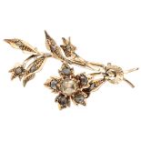 Antique 14K. rose gold floral brooch set with rose cut diamonds.