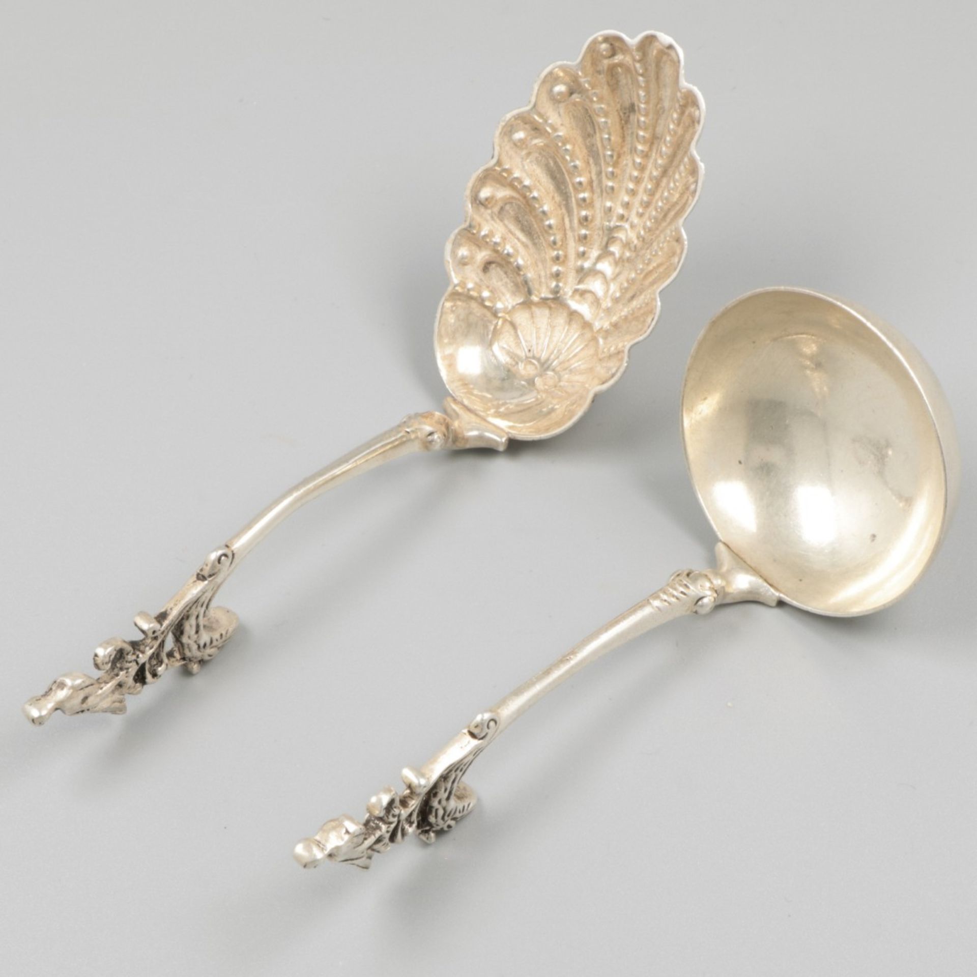 2-piece lot cream spoons silver.