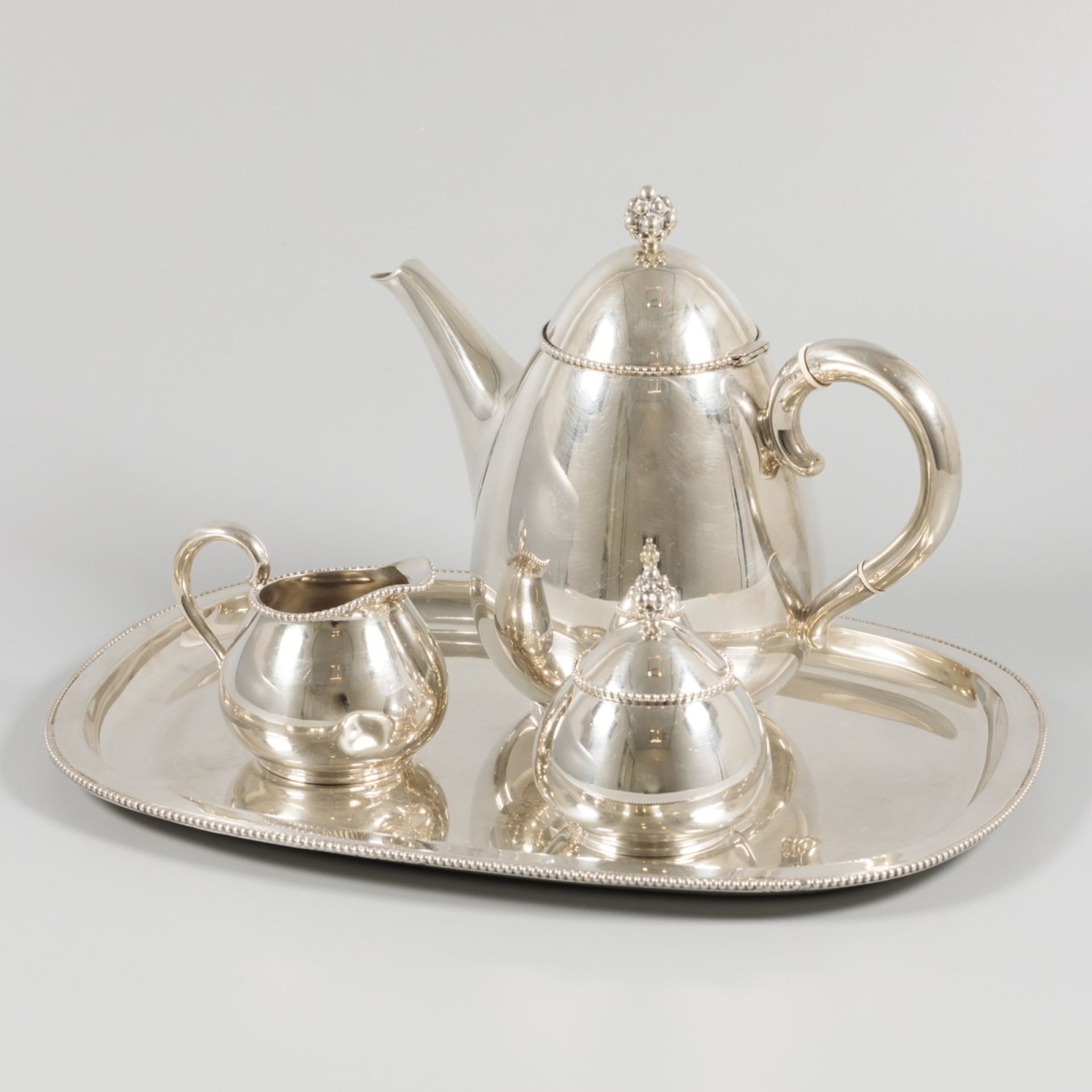 4 piece silver tea set.