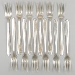 12-piece set of silver pastry forks.