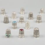 13-piece lot of silver thimbles.