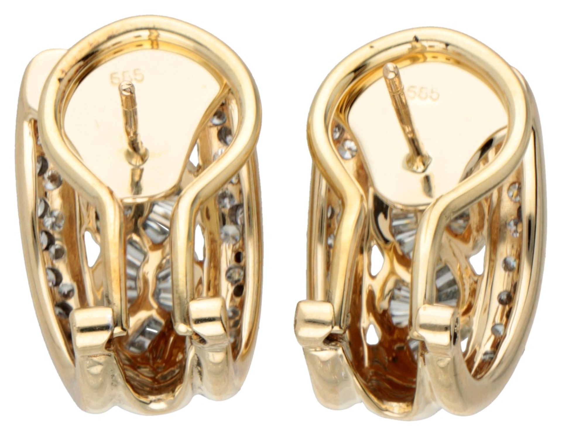 14K. Bicolor gold earrings set with approx. 0.70 ct. diamond. - Image 2 of 2