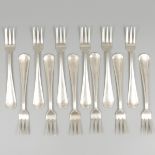 12-piece set of silver pastry forks.