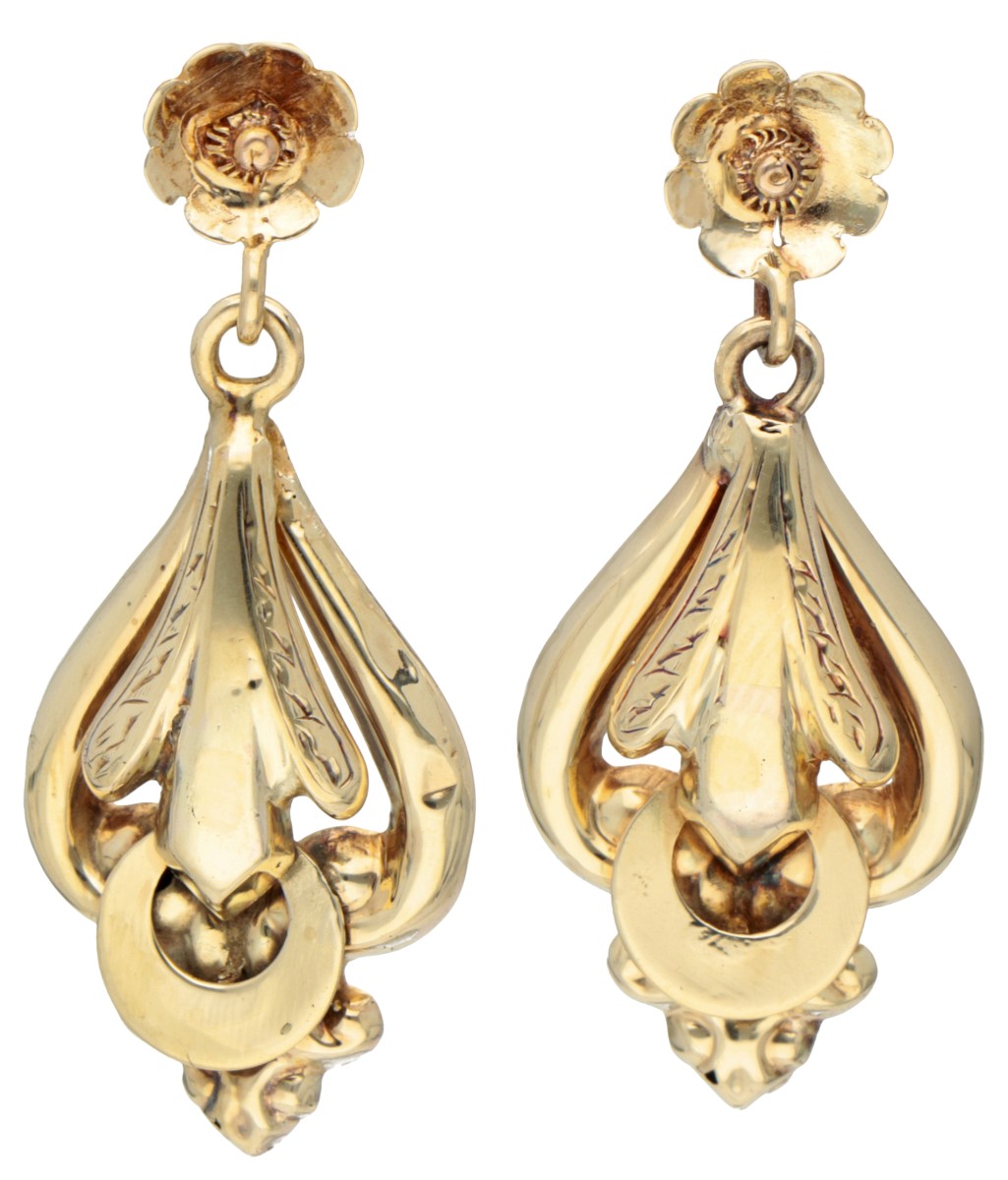 Antique 14K. yellow gold earrings with floral representations and hand-engraved details.