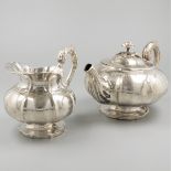 Teapot and milk jug silver.