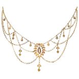 Antique 14K. yellow gold festoon necklace with graceful cannetille work and filigree depicting leave