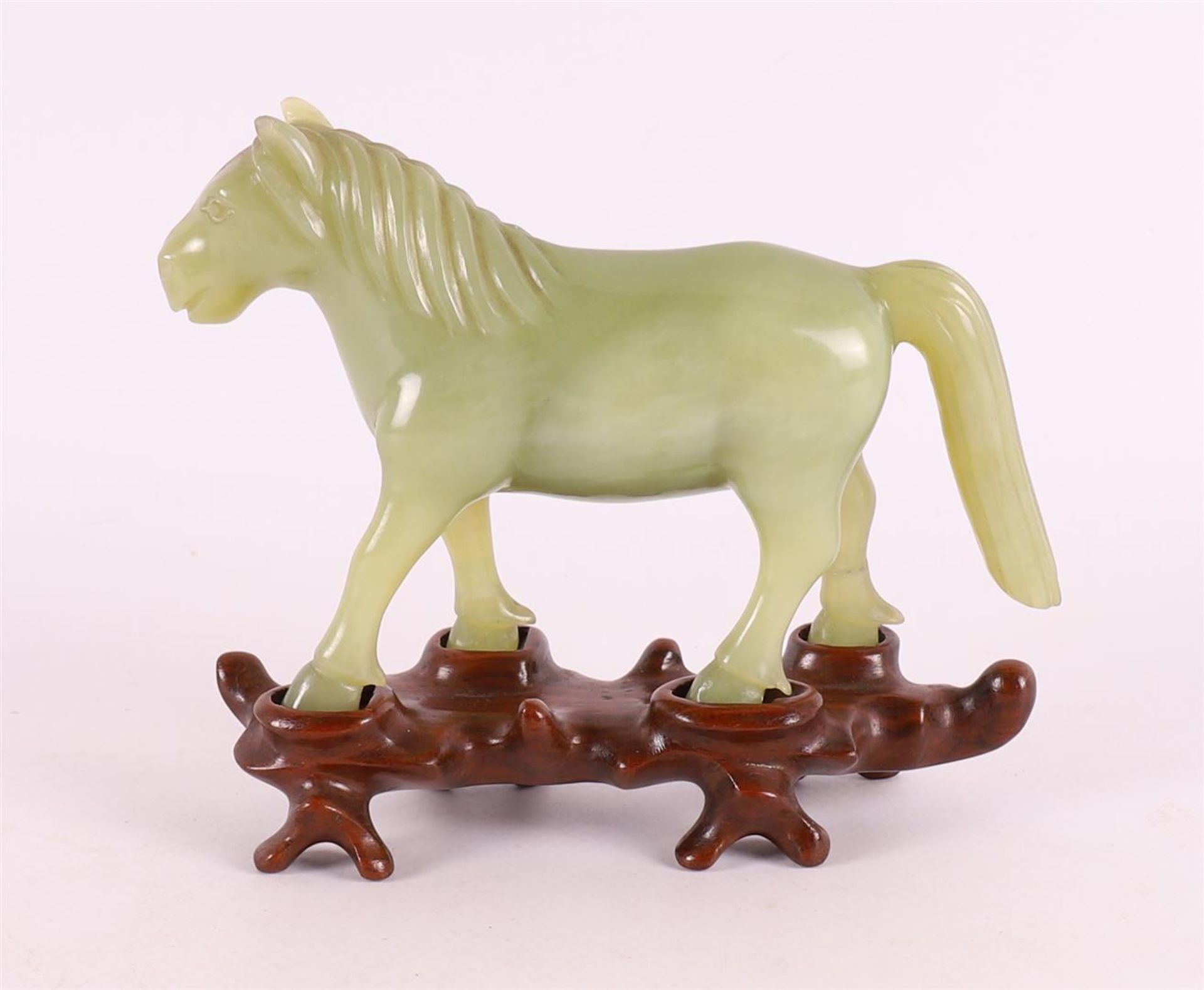 A green jade horse on a tropical wooden loose pedestal, China, around 1900. - Image 2 of 6