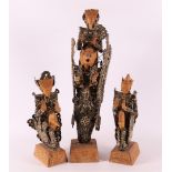 Three various tropical wooden kèpeng figures with Chinese coins, Indonesia.