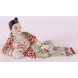 A porcelain reclining lady as a perfume bottle, China, circa 1900.