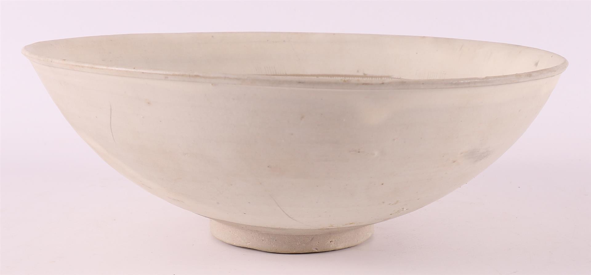 A white porcelain bowl with sgraffito decor, China, Sung, 12th/13th C. - Image 7 of 8