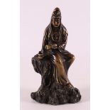 A brown patinated bronze Kwan Yin, China 19th century.