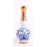 A blue and white porcelain sprinkler with 14 kt gold valve cap, China 18th centu