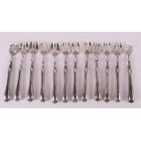 A series of twelve silver oyster forks, early 20th century.