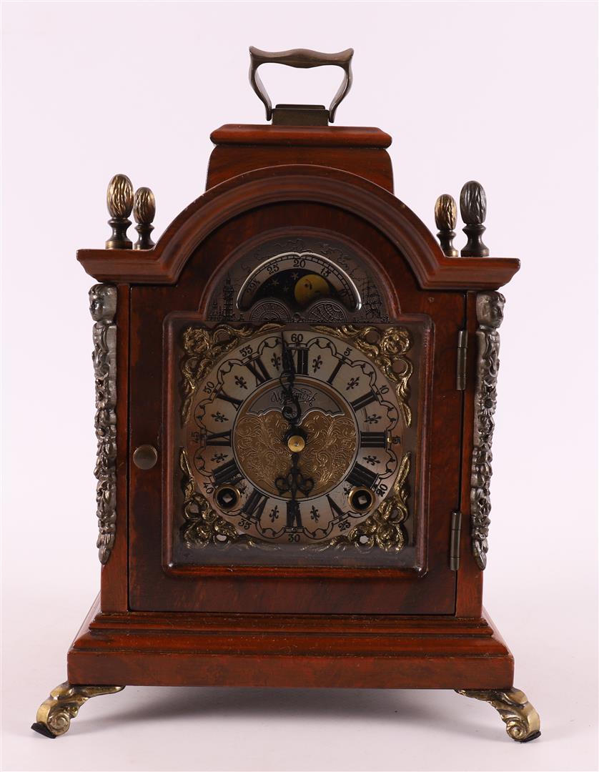 A table clock in a walnut case, Warninck, 20th century.