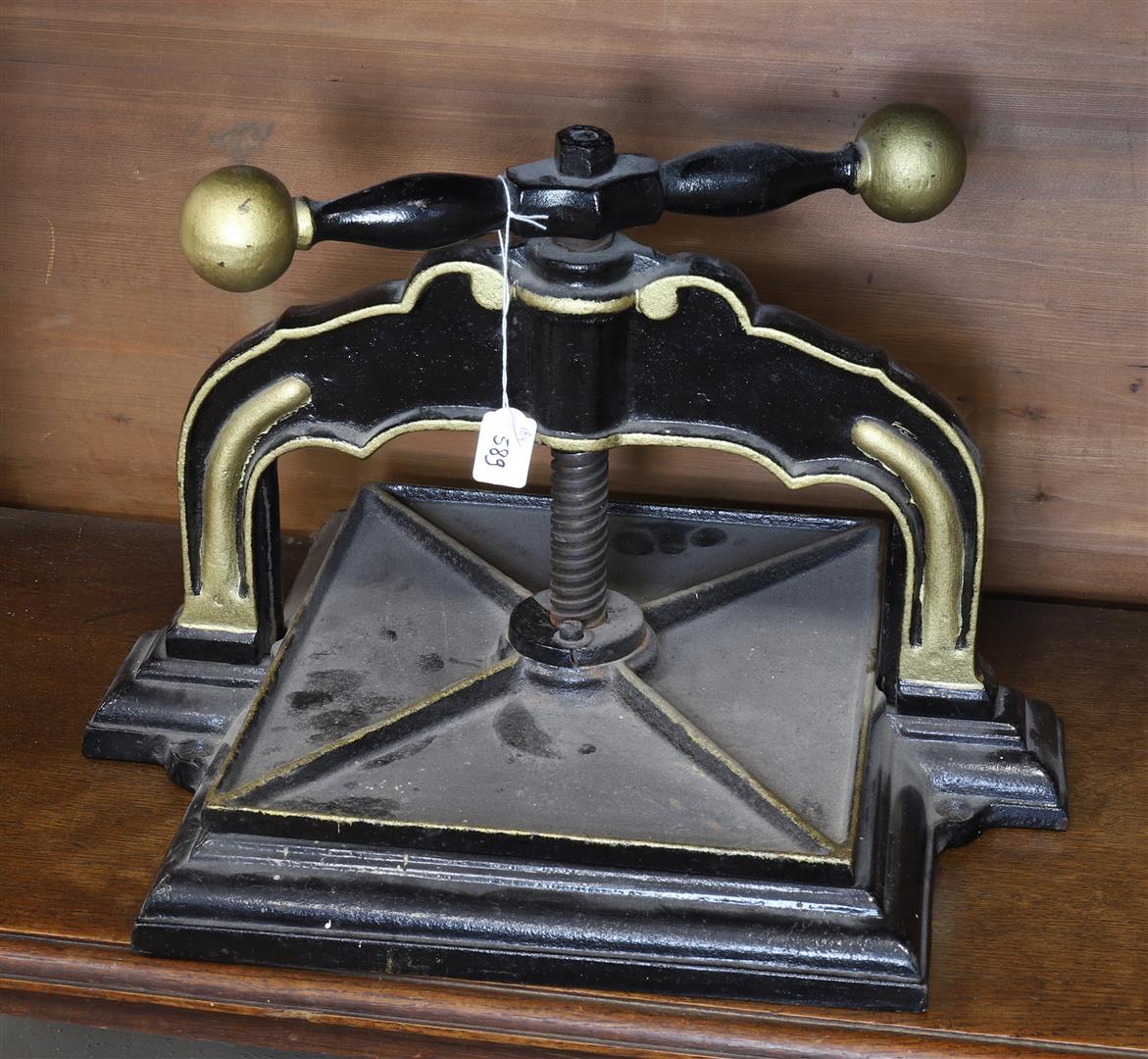 A cast iron book press with rotary mechanism, 19th century.