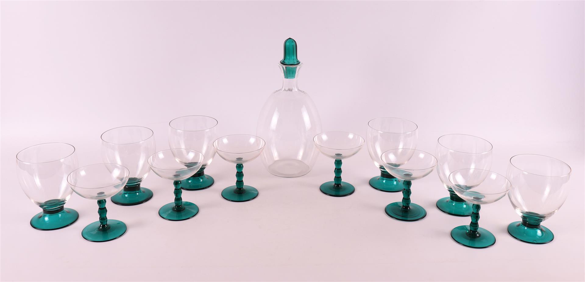 Netherlands, Maastricht. A clear glass decanter 'Omar' with green glass stopper,