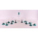 Netherlands, Maastricht. A clear glass decanter 'Omar' with green glass stopper,