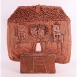 A terracotta relief with an image of cats, modern/contemporary.