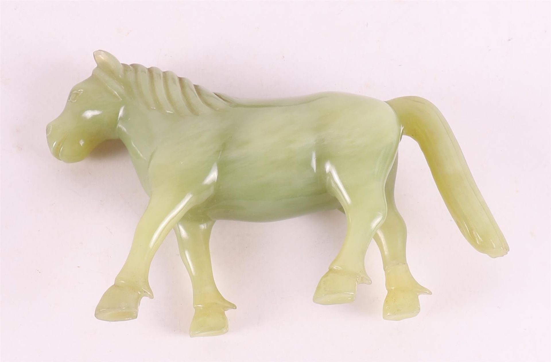 A green jade horse on a tropical wooden loose pedestal, China, around 1900. - Image 4 of 6