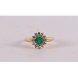 An 18 kt gold ring with an oval facet cut emerald.