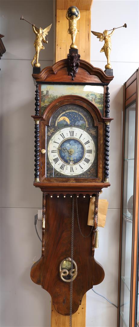 A double hooded tail clock with date and moon indication, 1st half 19th century.