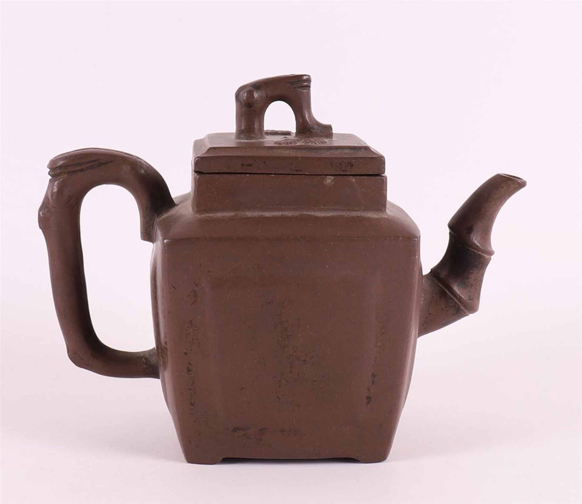 A dark brown Yixing teapot, China 19th century.