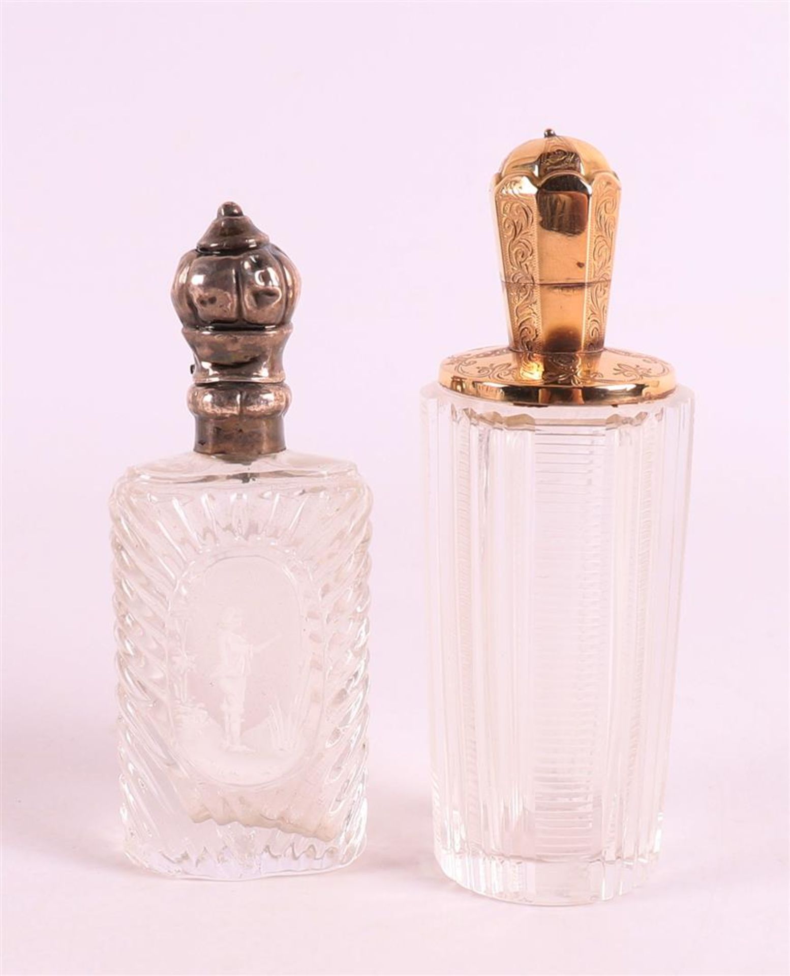 A clear crystal odeur flask with gold flip lid and frame, 19th C.
