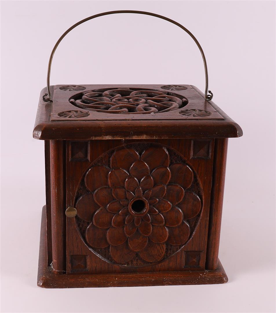 A square oak stove with brass handle, 19th century.