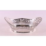 An ajour 2nd grade silver bread basket with pearl rim.