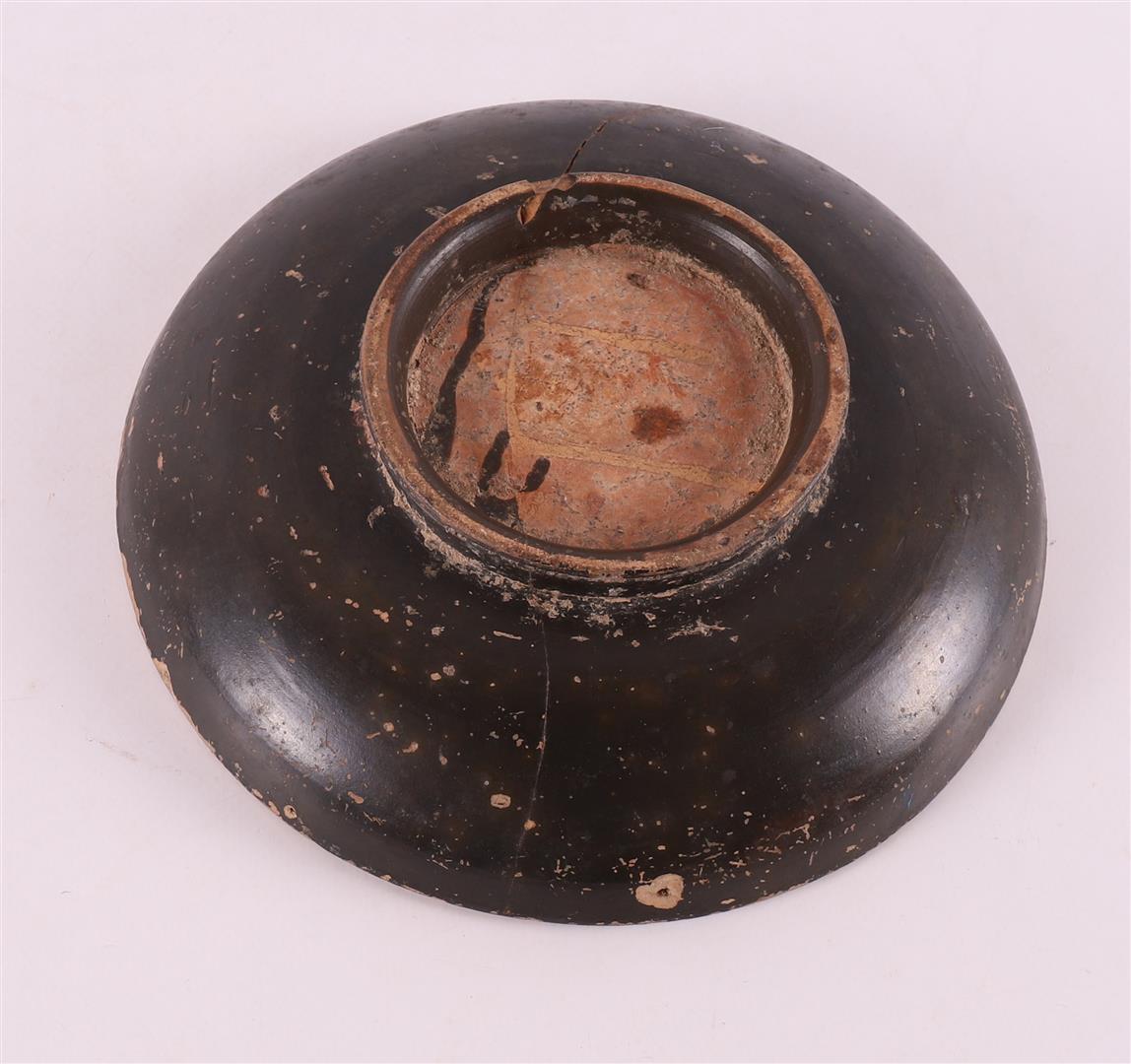 A black glazed earthenware bowl, Greece, 4th century b.c. - Image 4 of 4