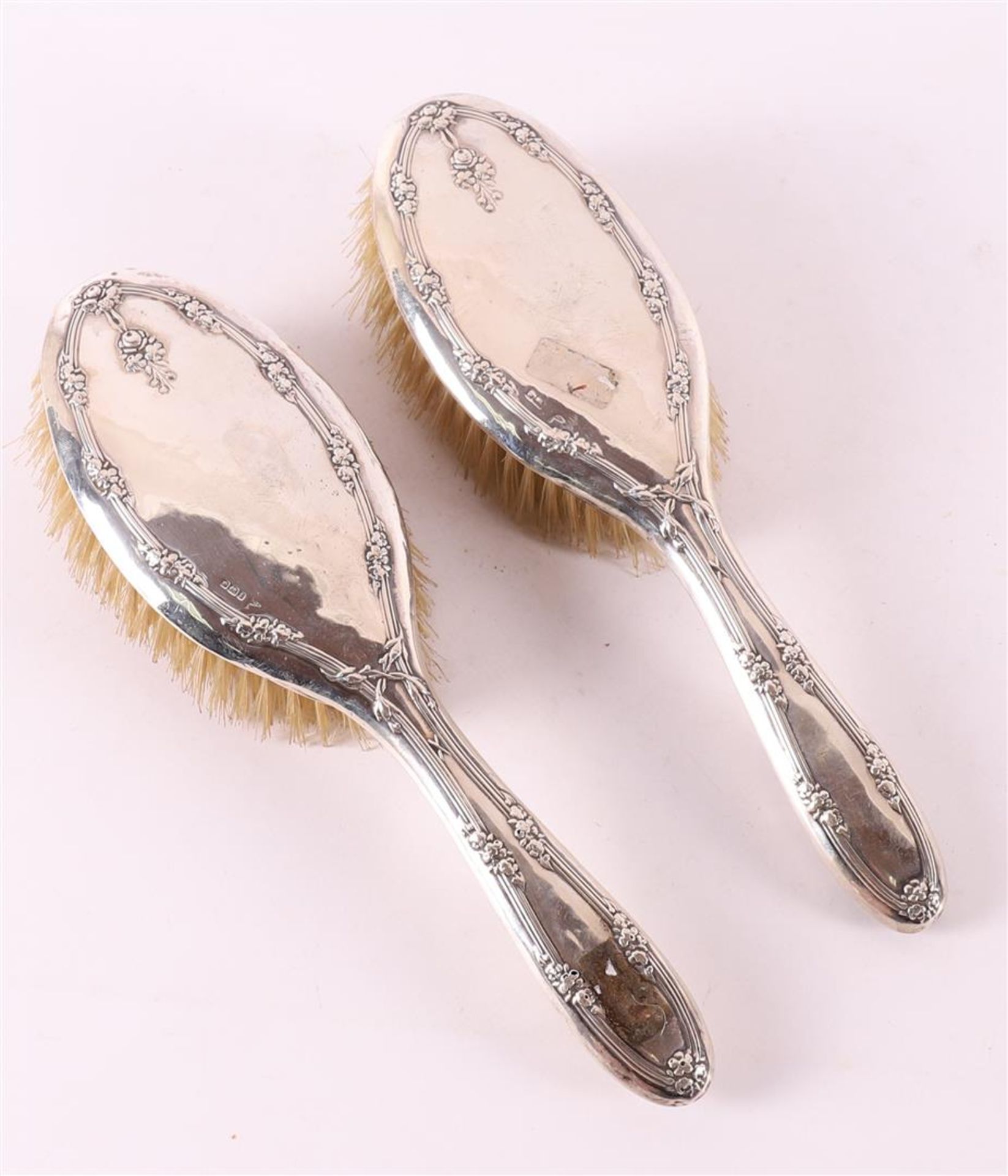 A set of silver-mounted brushes, circa 1900.