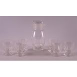 A clear glass cocktail shaker 'Neutral' with six glasses, 1929. W.J. Rozendaal.
