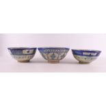 Three earthenware bowls on a stand ring, Persia, 19th century.