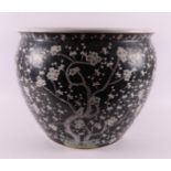 A porcelain famille noir fish bowl, China, circa 1900.