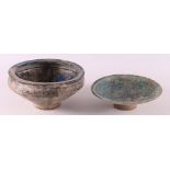 A blue glazed Persian earthenware bowl on base ring, 15th C.