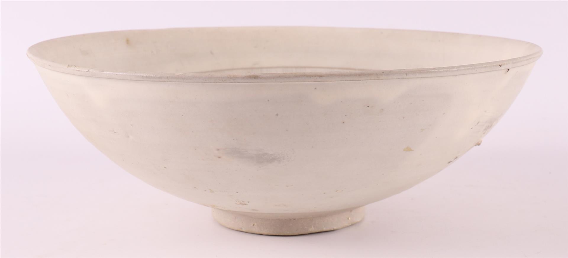 A white porcelain bowl with sgraffito decor, China, Sung, 12th/13th C. - Image 8 of 8