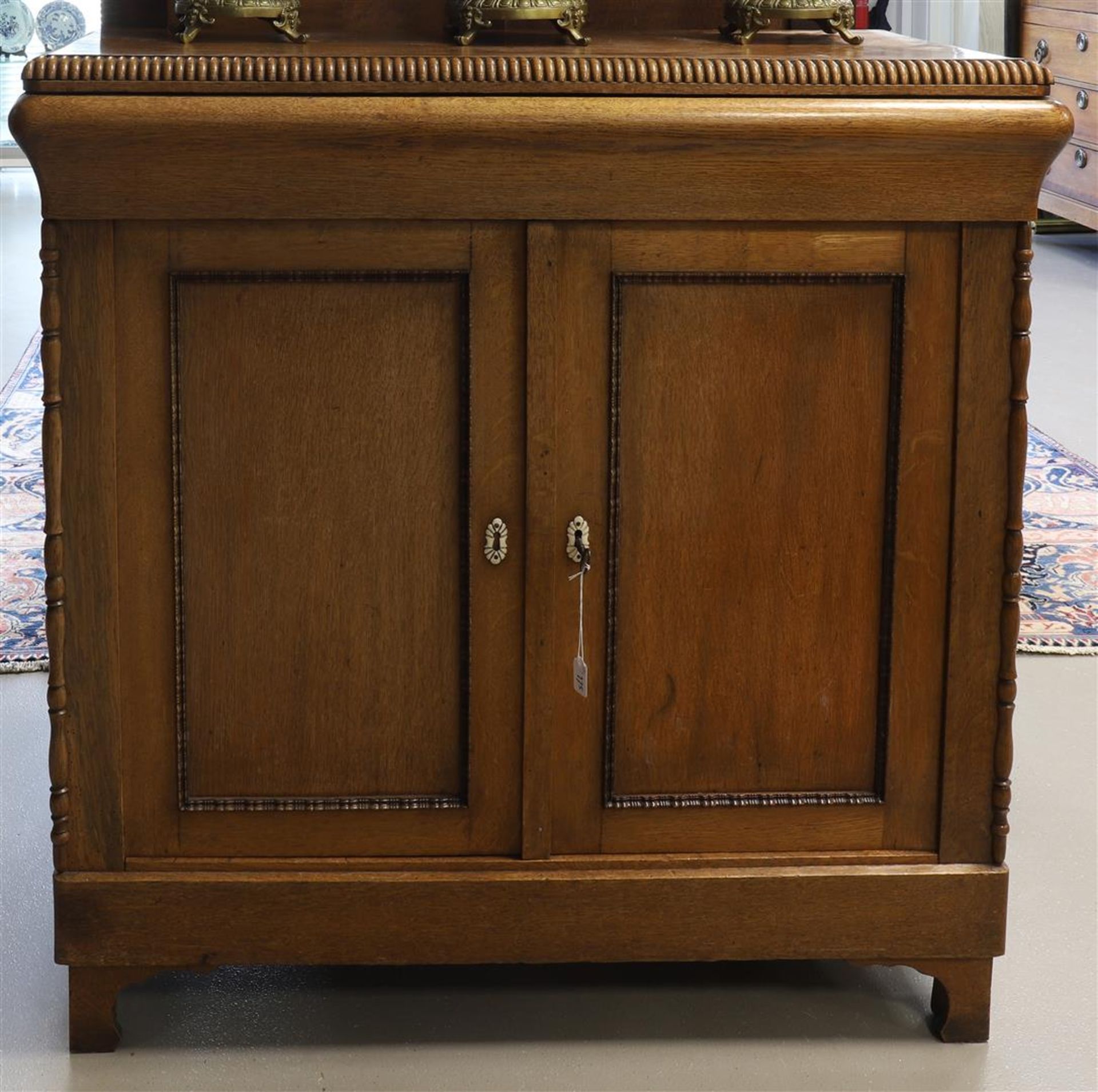 A two-door penant cabinet, late 19th century.