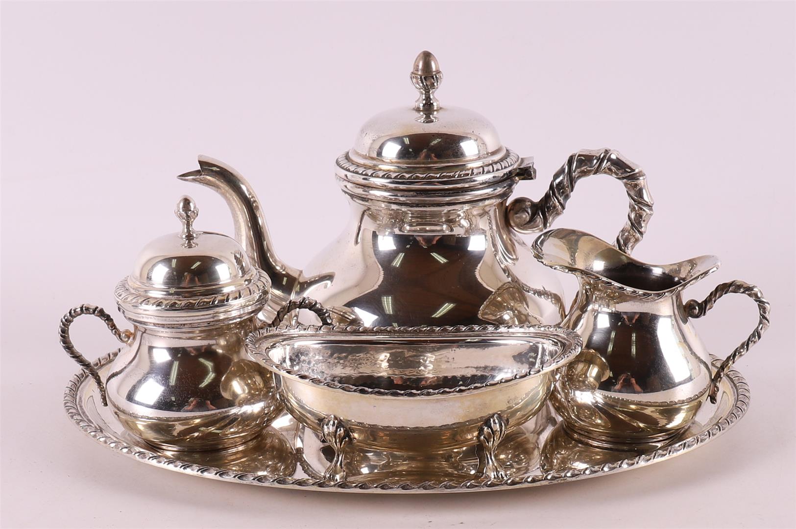 A 3rd grade 800/1000 silver tea service on a silver platter, 20th century