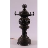 A bronze pagoda-shaped table lamp, Japan, circa 1900.