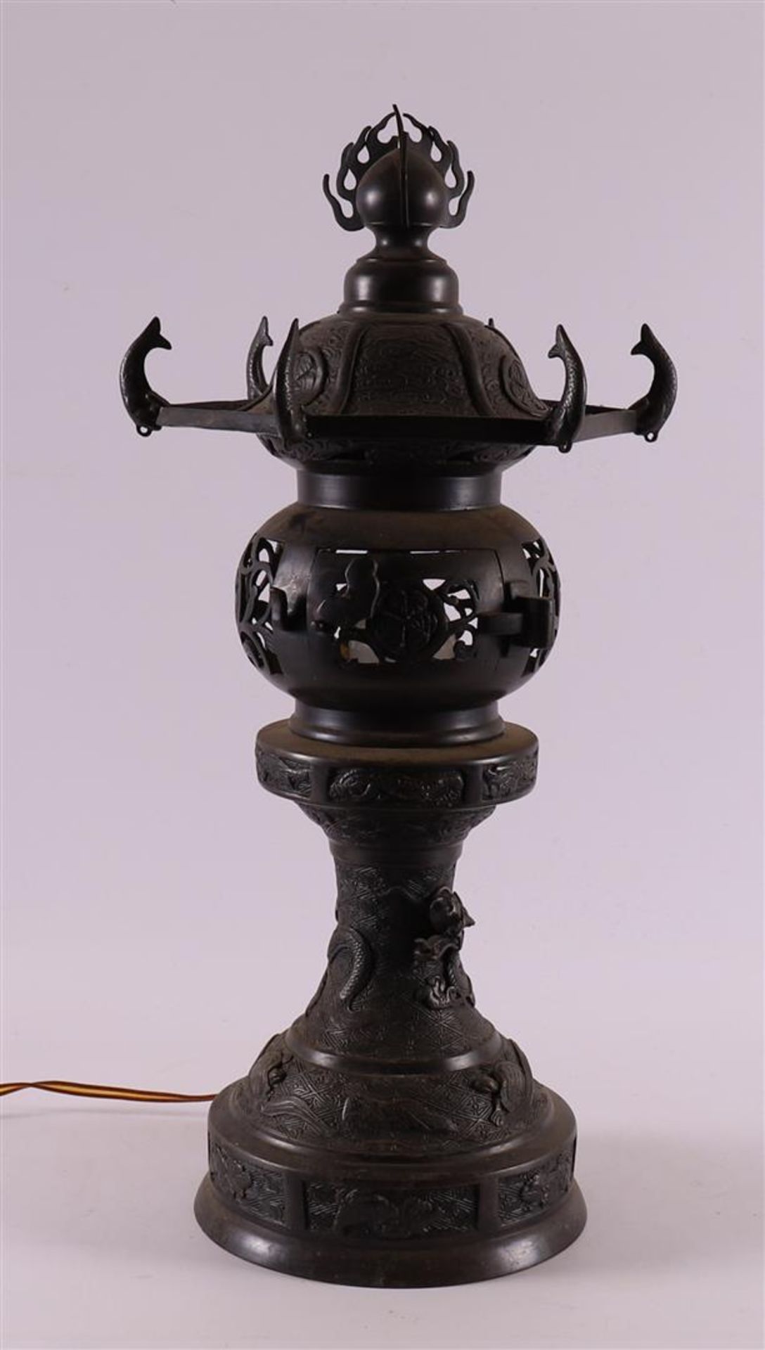 A bronze pagoda-shaped table lamp, Japan, circa 1900.