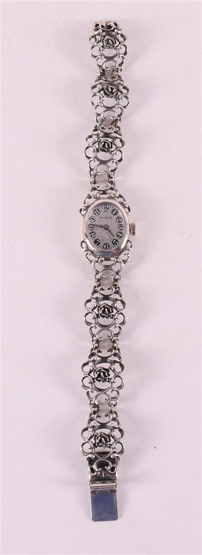 A second grade silver women's wristwatch with ajour band
